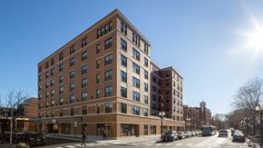 Chicago apartment for rent - Looking at the exterior of Wrigleyville Lofts from across the street on a clear, sunny day.