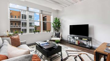 Chicago apartment for rent - a living room with a couch and a tv