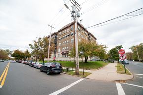 New Haven apartment for rent - A street with cars parked on the side and a no parking sign.
