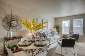 Richland multi-family for rent - A dining room with a white table and chairs.