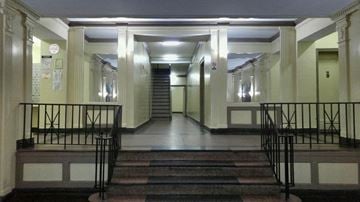 Elmhurst apartment for rent - the lobby of a building with stairs and columns