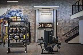 Kearny apartment for rent - A gym with a sign that says STRONG on the door.