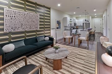 New Brunswick apartment for rent - A modern living room with a green sofa and a coffee table.