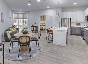 Hackensack apartment for rent - Kitchen with bar seating and stainless steel appliances in Ora luxury apartments in Hackensack, NJ