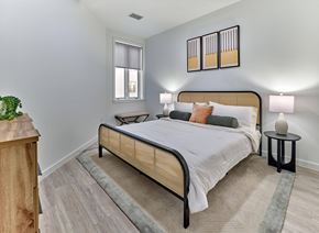 Hackensack apartment for rent - Bright bedroom with modern furnishings and bold accent art at Ora in Hackensack, NJ