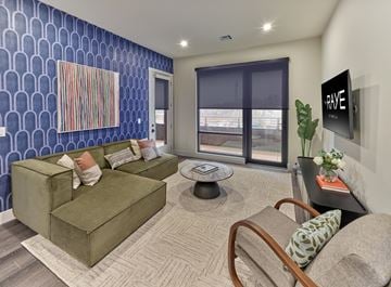 New Brunswick apartment for rent - A living room with a green couch and a painting on the wall.