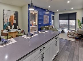 New Brunswick apartment for rent - A modern kitchen with a dining table and chairs.