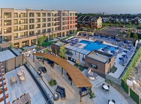 New Brunswick apartment for rent - A modern outdoor pool area with a wooden roof and seating area.