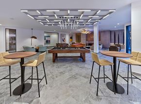 Orange apartment for rent - Club room with game tables, lounge and table seating, private resident club room