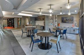 Garwood apartment for rent - A modern dining area with a wooden table surrounded by chairs.