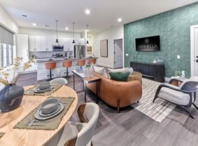 Hackettstown apartment for rent - A modern dining room with a wooden table set for two.