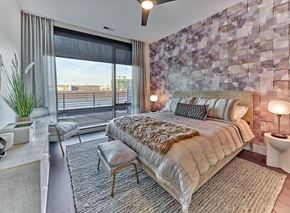 Union apartment for rent - A bedroom with a large bed and a view of the city.