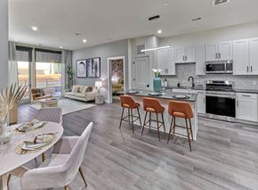 Union apartment for rent - A modern kitchen with a dining table set for two.
