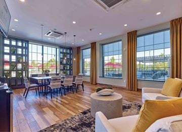 Kearny apartment for rent - A spacious living room with a dining table and chairs.