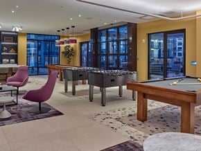 Woodbridge apartment for rent - a game room with pool tables and a bar