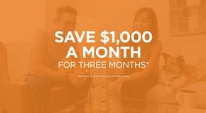 West Kelowna townhouse for rent - A man and a woman sitting on a couch with a dog, with text offering a savings deal.
