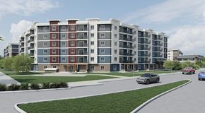 Ottawa apartment for rent - A modern apartment building with cars parked in front.
