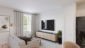 Selkirk apartment for rent - A modern living room with a grey sofa and a wooden cabinet.