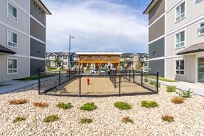 Edmonton apartment for rent - A playground with a swing set and a red fire hydrant.
