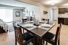 Red Deer apartment for rent - A dining room with a table set for a meal.