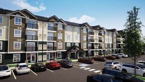 Saskatoon apartment for rent - A row of apartment buildings with cars parked in front.