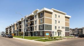 Lethbridge apartment for rent - Large multi level apartment building with parking along the street and private parking lot behind