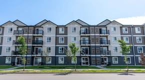 Edmonton apartment for rent - A four storey tall apartment building with a roadway in front