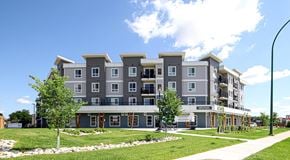 Winnipeg apartment for rent - A modern apartment building with commercial space at ground level
