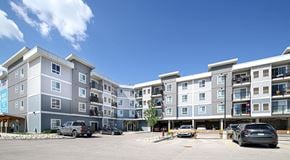 Winnipeg apartment for rent - An apartment building with parking lot in front, and covered parking