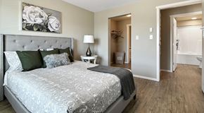 Summerland apartment for rent - A bedroom with a large bed and a walk through closet