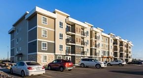 Lethbridge apartment for rent - A four storey apartment building with parking in front