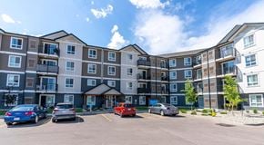 Edmonton apartment for rent - A large apartment building with parking in front