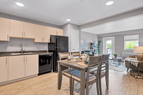 Courtenay apartment for rent - A kitchen with a table and chairs in the middle of the room.