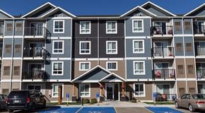 Winnipeg apartment for rent - A large modern apartment building with balconies and lots of windows