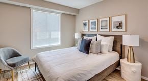 Brandon apartment for rent - A bedroom with a large bed and window