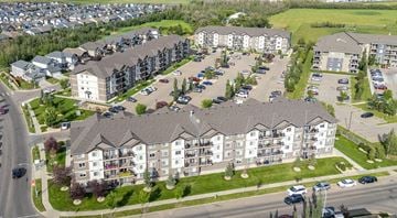 Edmonton apartment for rent - A large apartment complex with multiple buildings and parking lots.