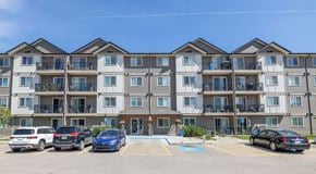 Edmonton apartment for rent - A large apartment building with parking out front