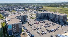 St. Albert apartment for rent - A large apartment complex with a large parking lot in the centre