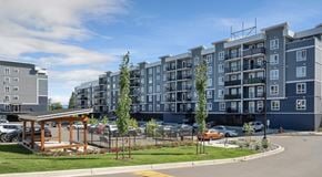 Courtenay apartment for rent - A mordern apartment complex with lots of parking in front with a pergola and dog run