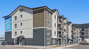 Warman apartment for rent - A four storey apartment building with parking in front