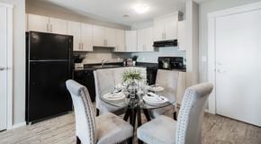 Lethbridge apartment for rent - A kitchen with light cabinets and black appliances