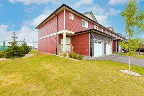 Winnipeg apartment for rent - A red house with a white door and windows.