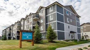 Edmonton apartment for rent - A large apartment building, with green grass out front