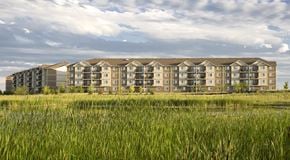 Winnipeg apartment for rent - A large apartment complex, next to a grassy field