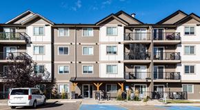 Saskatoon apartment for rent - An apartment building with parking spaces in front