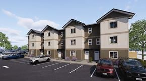 Fernie townhouse for rent - A row of townhouses with cars parked in front.