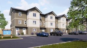 Fernie townhouse for rent - A rendering of a modern apartment complex with a sign that says "Bentley Crossing".