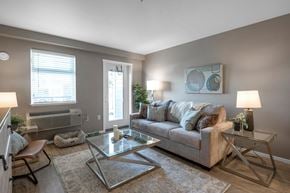 Campbell River apartment for rent - A living room with a couch, two chairs, and a coffee table.