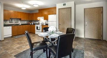 Saskatoon apartment for rent - A kitchen with a table set for two.
