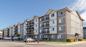 Saskatoon apartment for rent - A large apartment building with parking out front